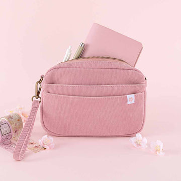 Tsuki ‘Sakura Journey’ Travel Pouch with Tsuki ‘Sakura Journey’ Limited Edition Travel Notebook and pens inside with Tsuki ‘Sakura Journey’ Vintage Journal Washi Tape Set with cherry blossoms in pink background